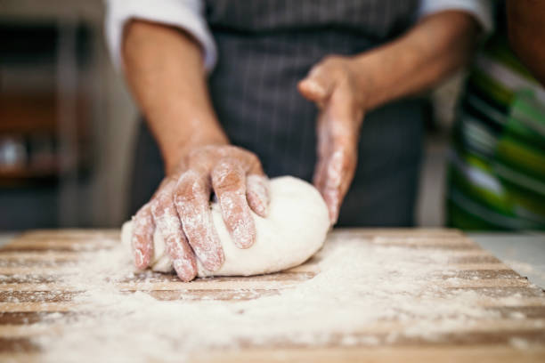 istock Senior woman mixing flour 1173337014