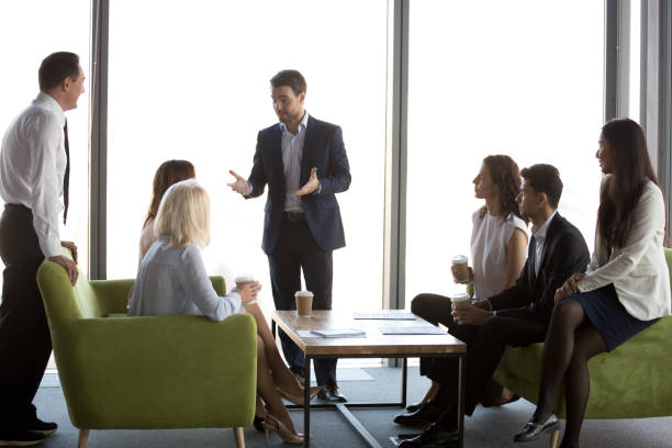 istock Businesspeople enjoy coffee talking during informal office meeting 1173338426