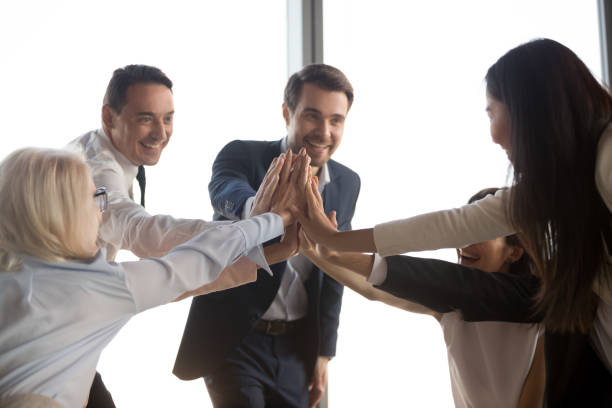 istock Excited colleagues give high five motivated for success 1173338433