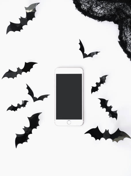 istock Halloween flat lay with mock-up and holidays decorations isolated on white. 1173339050