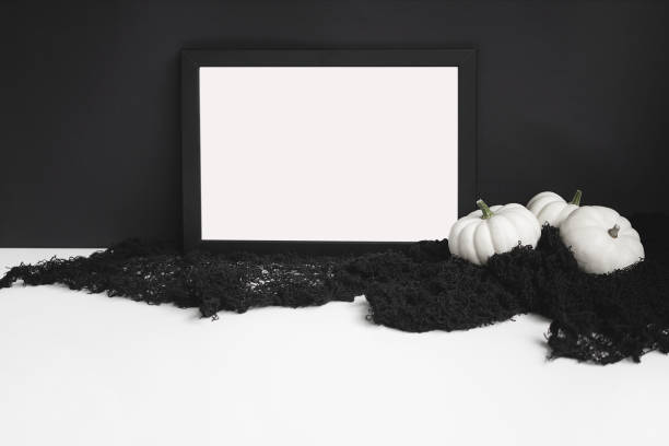 Halloween concept frame mockups with white pumpkins on black background. Minimal mock ups. Halloween styled flat lay katt halloween stock pictures, royalty-free photos & images