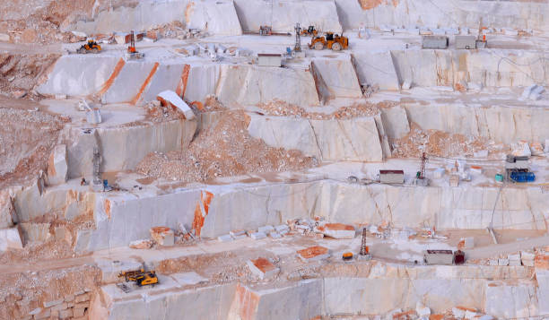 istock Marble quarry with a Excavator loader, marble block 1173342079