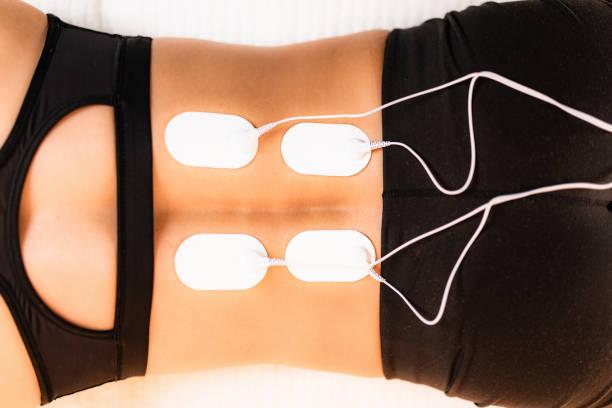Lower Back Physical Therapy With Tens Electrode Pads Transcutaneous  Electrical Nerve Stimulation Stock Photo - Download Image Now - iStock