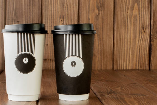 istock Take-out coffee in thermo cup on a wooden background, Copy space. 1173343842