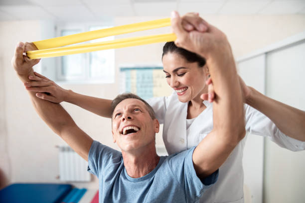istock Happy man is doing stretching rehab exercises 1173345363