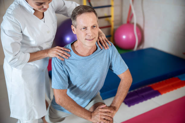 istock Smiling man man lunging with legs in room 1173345372