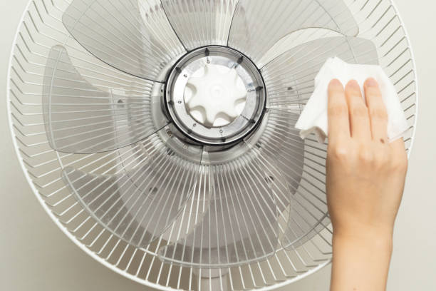 istock Clean the electric fan with a dust cloth. 1173345532