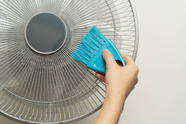 istock Clean the electric fan with a brush. 1173345538