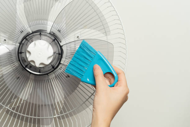 istock Clean the electric fan with a brush. 1173345560