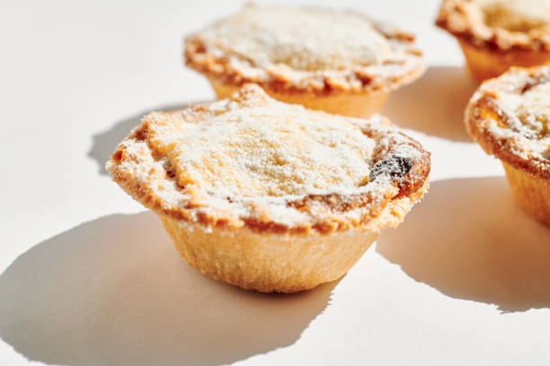 istock several Mince pies against a white background with shadow. 1173345893