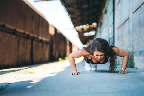 istock Woman working out at old train station 1173347057