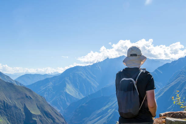 istock Young hiker man trekking with backpack in Peruvian Andes mountains, Peru, South America 1173348384