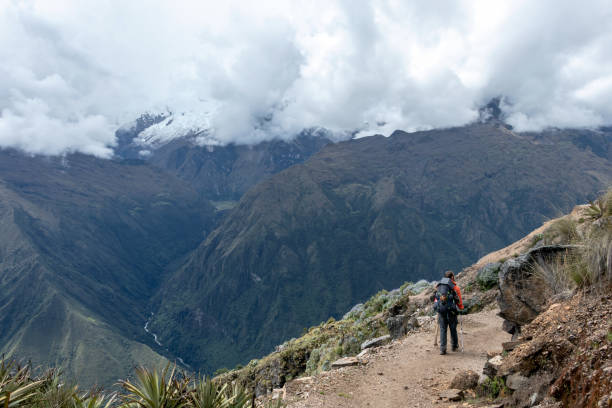 istock Young hiker man trekking with backpack in Peruvian Andes mountains, Peru, South America 1173348414