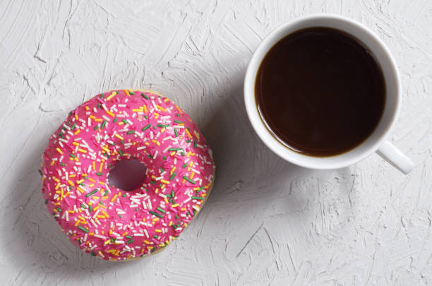 istock Cup of coffee and glazed donut 1173349172