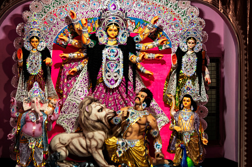 Durga puja background image. Sculpture of maa durga or maha kali or adi parashakti or bhabani taken at a barowari home based pooja occassion in west bengal.