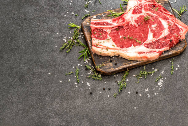 istock Raw beef steak meat herbs spices Food background 1173351912