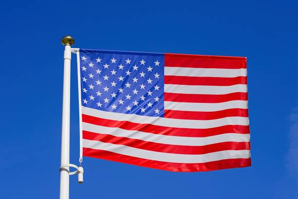 istock American flag on the blue sky 1173353407