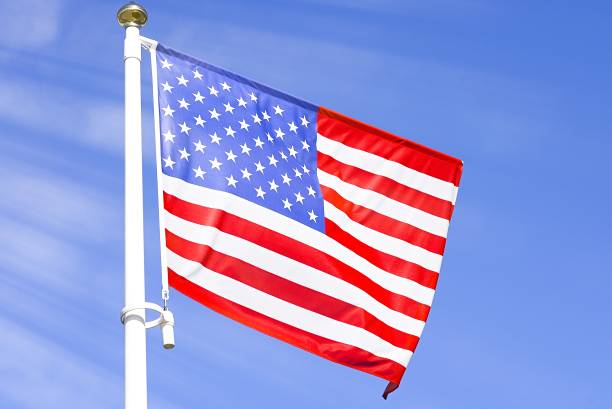 istock American flag on the blue sky 1173353458