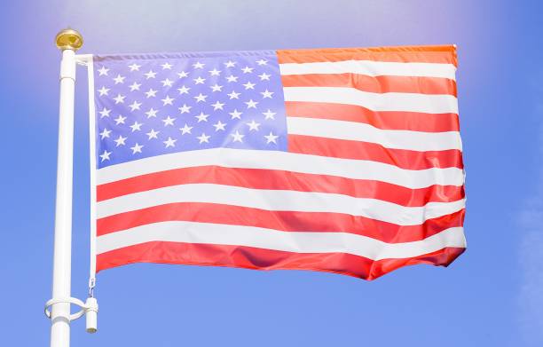 American flag on the blue sky