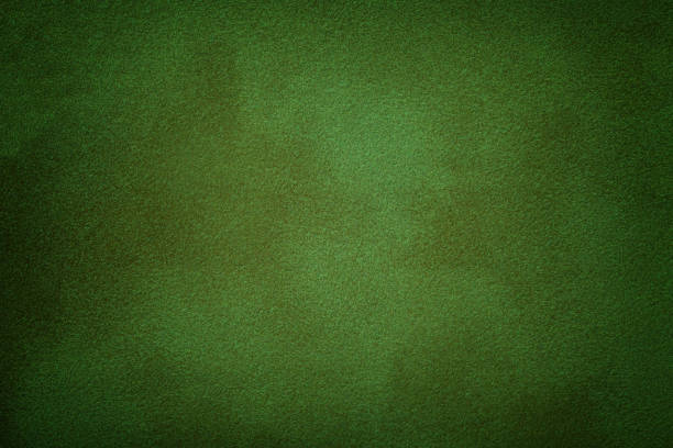 istock Dark green matte background of suede fabric, closeup. 1173355737