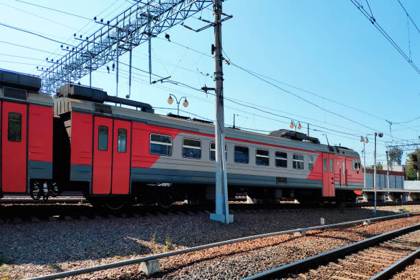 istock Red suburban train on the station close up. Railway platform with train. 1173355785