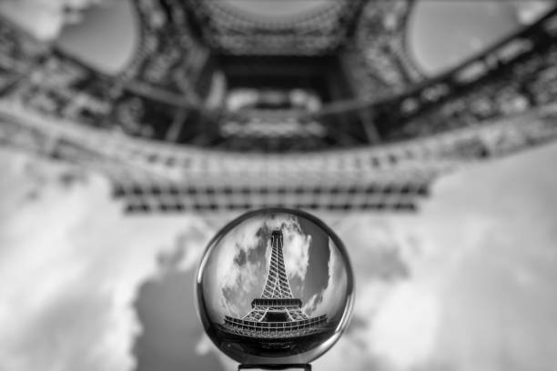 Tour Eiffel (Eiffel Tower) at sunrise viewed through the Mur Pour la Paix (Wall for Peace) on the Champ de Mars in Paris