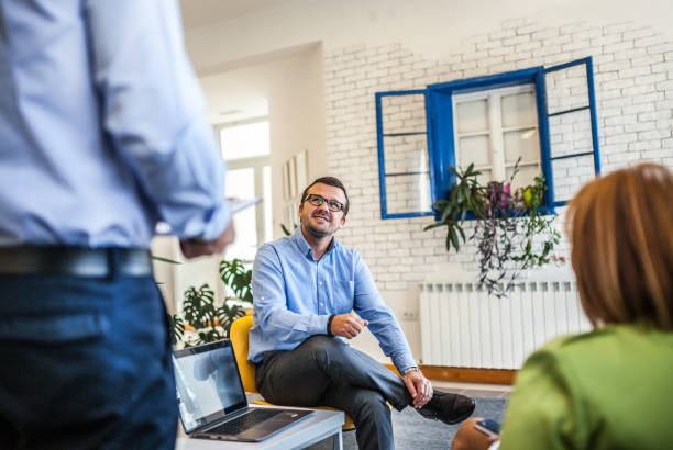 istock Businesspeople discussing plan with colleagues 1173360107