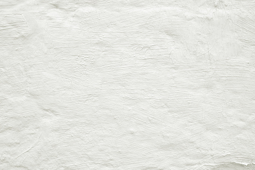 Close-up white painted grunge old wall texture background