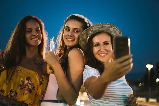 istock Women's night party at the pool 1173360512