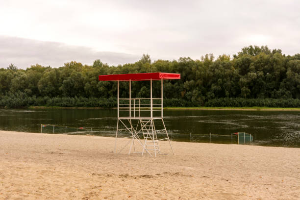 istock Rescue tower and fenced beach on the river. 1173362205