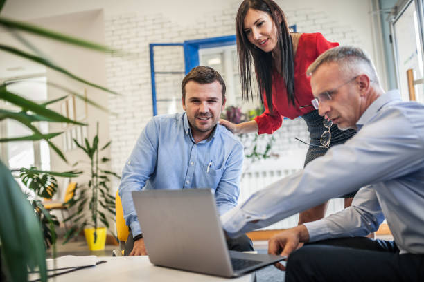 istock Businesspeople discussing plan with colleagues 1173362922