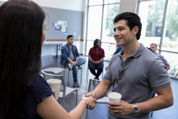 istock Veterans greet one another before meeting 1173363322