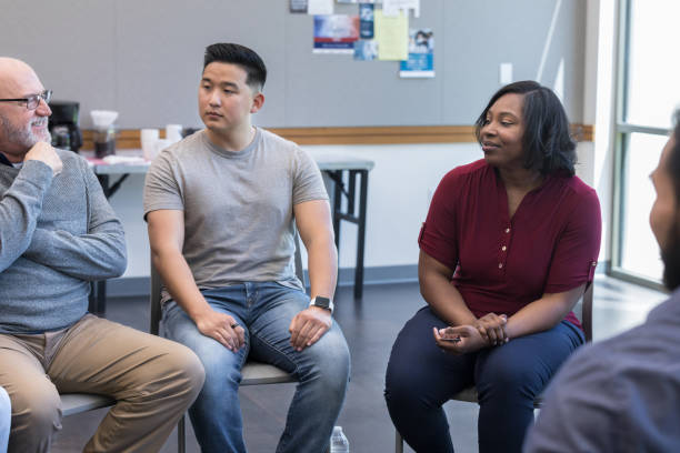 istock Senior male counselor leads support group for veterans 1173363334