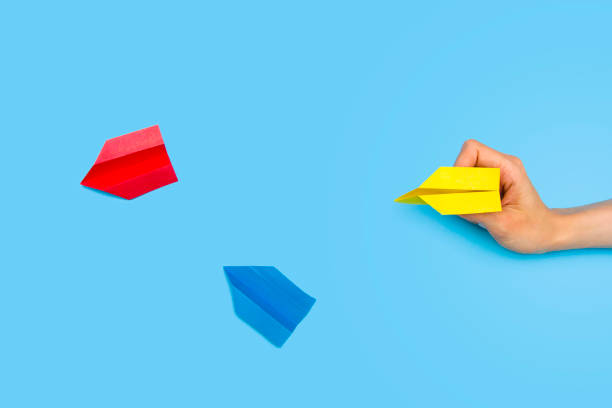 istock Paper airplane on a blue background 1173365048