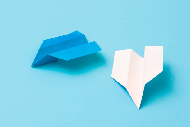 istock Paper airplane on a blue background 1173365682