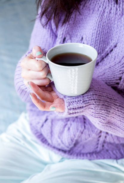 istock Young Woman Holding Cup With Hot Drink 1173365686