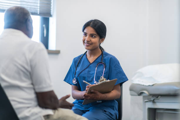 istock Kind Indian doctor meets with elderly patient 1173367875