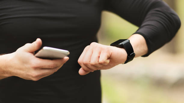 istock Man using fitness app on his smartwatch 1173368302