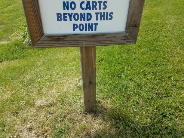 istock no carts beyond this point sign in grass 1173368859
