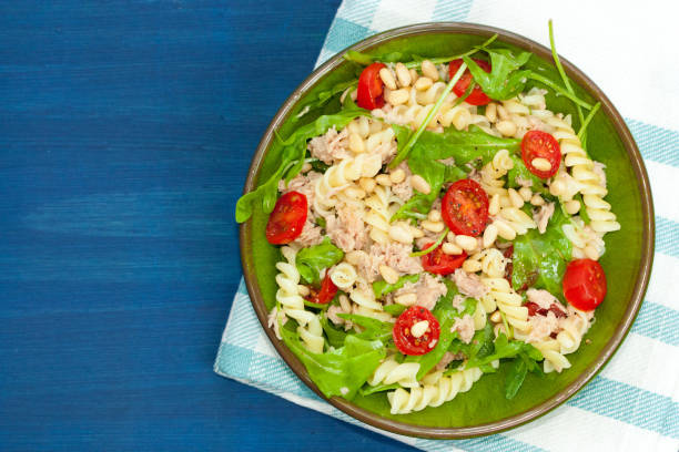istock Tuna salad with fusilli pasta, tomatoes and arugula. 1173370299