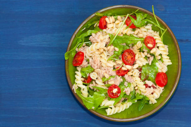 istock Tuna salad with fusilli pasta, tomatoes and arugula. 1173370304