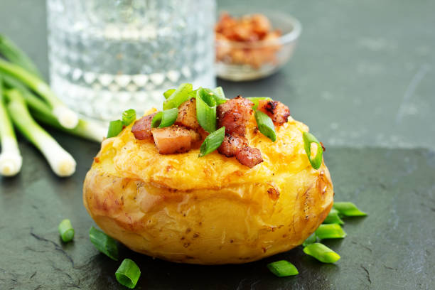 istock Stuffed baked potatoes with cheese and bacon. 1173370462