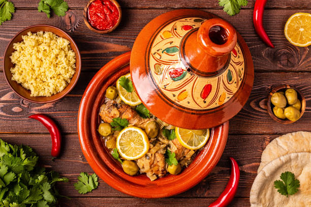 Traditional moroccan tajine of chicken with salted lemons, olives. Traditional moroccan tajine of chicken with salted lemons, olives. Top view. tajine stock pictures, royalty-free photos & images