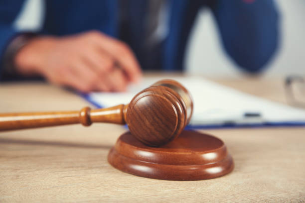 istock man  with  judge on desk 1173374286