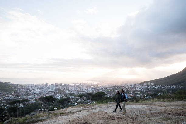 istock African couple hiking on Table Mountain against sky 1173375710