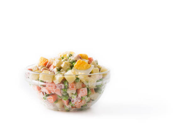 Traditional Russian salad for Christmas. Olivier salad isolated on white background.