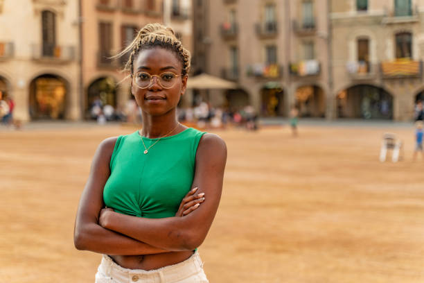 Determined young woman in plaça Major in Vic stock photo