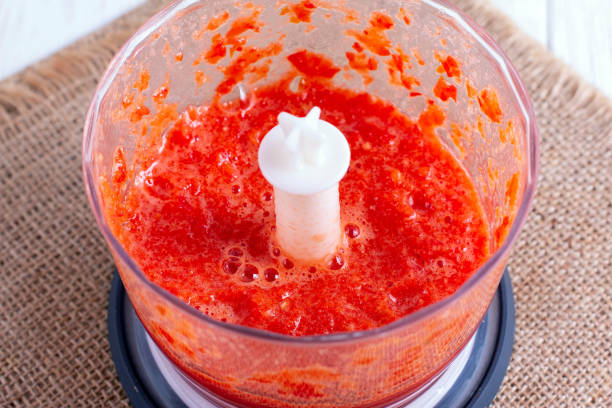 istock Preparing an red tomato cocktail in a blender 1173380410