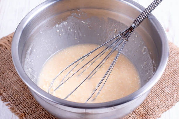 istock Mixing butter, sugar and eggs in bowl with mixing machine 1173381827