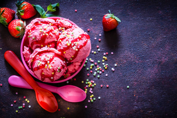 istock Strawberry ice cream shot on rustic table. Copy space 1173381905